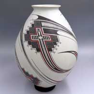 Polychrome jar with a flared lip and a 3-panel geometric design
 by Jorge Quintana of Mata Ortiz and Casas Grandes
