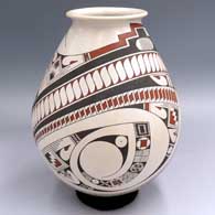 Polychrome jar with a flared rim and a 2-panel sickle and geometric design
 by Jorge Quintana of Mata Ortiz and Casas Grandes