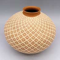 White-on-brown jar with slightly flared lip and geometric pattern
 by Arturo Quezada of Mata Ortiz and Casas Grandes