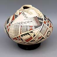 Polychrome jar with lizard applique over opening and painted geometric design
 by Celia Lopez of Mata Ortiz and Casas Grandes