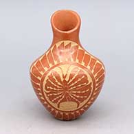 Brown jar with asymmetrical opening with sgraffito butterfly and ring of feathers design
 by Lorraine Chinana of Jemez