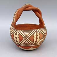 Polychrome friendship basket with twisted handle and geometric design
 by Unknown of Isleta