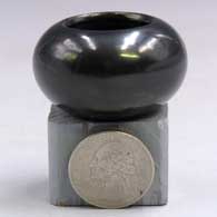Plain, polished miniature black jar
 by Shirley Tafoya of Santa Clara