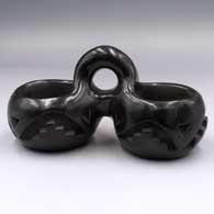 Double-bowl black piece carved with a kiva step and geometric design
 by Camilio Tafoya of Santa Clara