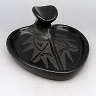 Black-on-black heart-shaped ashtray painted with a geometric design, made for the tourist trade
 by Helen Shupla of Santa Clara