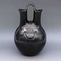 Black wedding vase with bear paw imprint
 by Virginia Garcia of Santa Clara