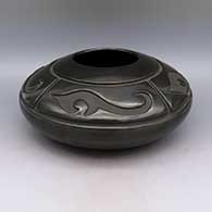 Black jar with carved four panel geometric design
 by LuAnn Tafoya of Santa Clara