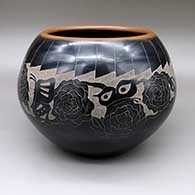 Large black bowl with a sienna rim and a sgraffito butterfly, flower, and feather ring geometric design
 by Vickie Martinez of Santa Clara