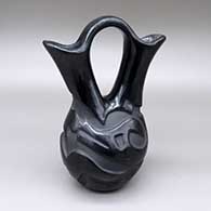 Black wedding vase with a carved avanyu design
 by Madeline Tafoya of Santa Clara