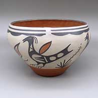 Polychrome jar with a bird, yucca plant, and flower design on exterior and a geometric design on interior
 by Ambrose Atencio of Santo Domingo