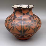 Polychrome jar with a flared opening, an eight-panel geometric design on outside, and a sgraffito and painted bird, handprint, and spiral design on inside
 by Robert Tenorio of Santo Domingo