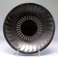 Shallow black-on-black bowl with a ring of feathers design
 by Carmelita Dunlap of San Ildefonso
