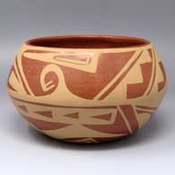 Polished red bowl painted in the negative with a matte red geometric design
 by Martha Appleleaf of San Ildefonso