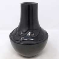 Black jar carved with an avanyu design
 by Rose Gonzales of San Ildefonso
