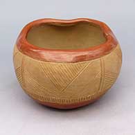 Potsuwii jar with an inscribed geometric design filled with micaceous clay and indented lip
 by Tomasita Reyes Montoya of Ohkay Owingeh
