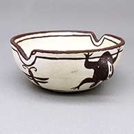 Small black-on-white ashtray with an applique and painted frog and bee design
 by Nellie Bica of Zuni