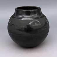 Black jar with avanyu design
 by Pablita Chavarria of Santa Clara