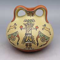 Polychrome jar with female yei, goat, and geometric design with handles
 by Margaret and Luther Gutierrez of Santa Clara