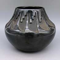 Black jar with carved feather ring and kiva step design
 by Teresita Naranjo of Santa Clara