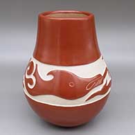 Red jar with a carved and sgraffito avanyu design
 by Daryl Whitegeese of Santa Clara and Pojoaque