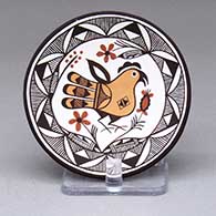 A small polychrome plate decorated with a parrot, flower and geometric design
 by Marilyn Ray of Acoma