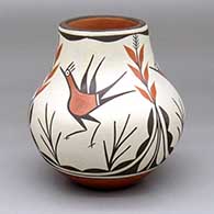 A polychrome water jar decorated with a three-panel roadrunner, plant and geometric design
 by Eusebia Shije of Zia