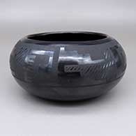 Black-on-black bowl with a geometric design
 by Maria Martinez of San Ildefonso