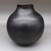 Micaceous black jar with an organic opening
 by Lonnie Vigil of Nambe