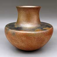 A golden micaceous jar with a flat shoulder and recurved neck
 by Lonnie Vigil of Nambe