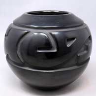 Black jar carved with a styled avanyu and geometric design
 by Nathan Youngblood of Santa Clara