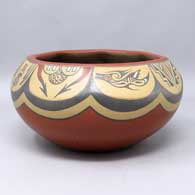 Polychrome bowl with 8 facets, each with a separate design
 by Margaret and Luther Gutierrez of Santa Clara