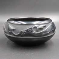 Black bowl carved with an avanyu design
 by Rose Gonzales of San Ildefonso
