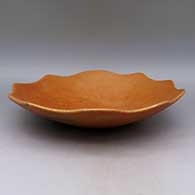 Micaceous gold shallow bowl with scalloped rim and fire clouds
 by Lonnie Vigil of Nambe