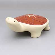 Red and buff turtle figure with a carved geometric design on shell
 by Anita Suazo of Santa Clara