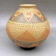 Polychrome jar with a flared opening and an indented and painted cuadrillos and geometric design
 by Consolacion Quezada of Mata Ortiz and Casas Grandes
