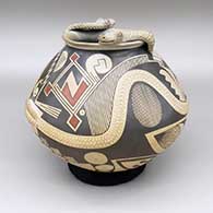 Polychrome jar with a applique rattlesnake and a painted geometric design
 by Juan Quezada Sr of Mata Ortiz and Casas Grandes