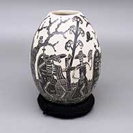 Black-on-white jar with a sgraffito Day of the Dead design
 by Hilario Quezada Jr of Mata Ortiz and Casas Grandes