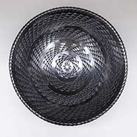 Large black bowl with an indented geometric design
 by Mariano Quezada of Mata Ortiz and Casas Grandes