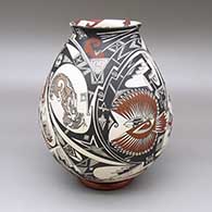 Polychrome jar with a slightly flared opening and a painted coyote, rabbit, bird, and geometric design; includes a polished red stand
 by Manuel Rodriguez Guillen of Mata Ortiz and Casas Grandes