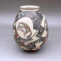 Polychrome jar with a flared opening and a painted coyote, rabbit, bird, and geometric design; includes polished red stand
 by Manuel Rodriguez Guillen of Mata Ortiz and Casas Grandes