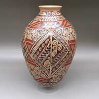 Large polychrome jar with a flared opening and a cuadrillos, fine line, and geometric design
 by Manuel Mora of Mata Ortiz and Casas Grandes