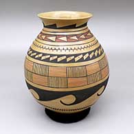 A polychrome jar with a flared opening and a geometric design
 by Ermeterio Ortiz of Mata Ortiz and Casas Grandes