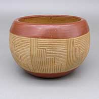 Red and micaceous gold Potsuwii bowl with a sgraffito geometric design band around sides and a micaceous gold slip interior
 by Rosita de Herrera of Ohkay Owingeh