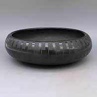 Black-on-black bowl with feather ring geometric design
 by Blue Corn of San Ildefonso