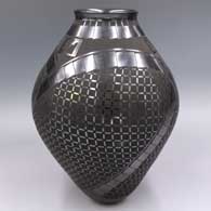Black-on-black jar with a flared rim and a 3-panel geometric design
 by Ismael Sandoval of Mata Ortiz and Casas Grandes