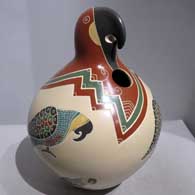 Polychrome parrot effigy jar with sgraffito and painted parrot and geometric design
 by Vidal Corona of Mata Ortiz and Casas Grandes
