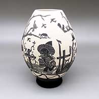Black-on-white jar with a sgraffito Day of the Dead design
 by Diana Loya of Mata Ortiz and Casas Grandes