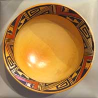 Polychrome bowl with band of geometric design inside and fire clouds inside and out 
 by Nancy Lewis of Hopi