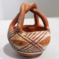 Polychrome friendship basket with twisted handle and geometric design
 by Unknown of Isleta