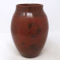 Brown jar with fire clouds and pine pitch coating
 by Susie Crank of Dineh